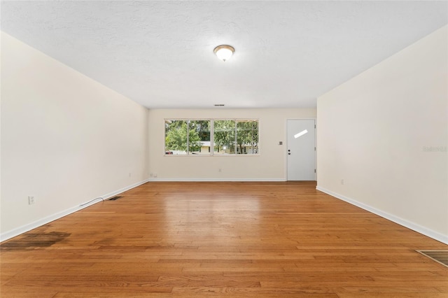 3857 SW 4th Pl, Gainesville, FL 32607 - unfurnished room featuring light wood finished floors and baseboards