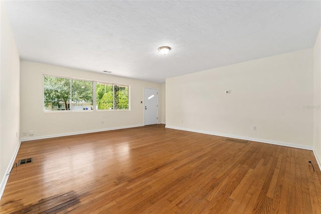 3857 SW 4th Pl, Gainesville, FL 32607 - unfurnished room featuring wood finished floors