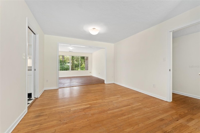 3857 SW 4th Pl, Gainesville, FL 32607 - spare room with light wood-style flooring and baseboards