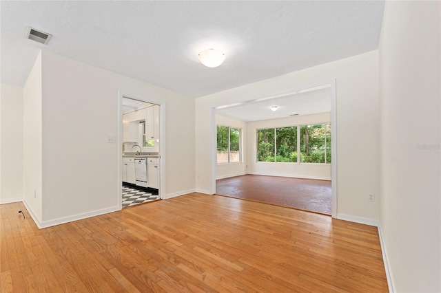 3857 SW 4th Pl, Gainesville, FL 32607 - empty room featuring light wood-type flooring and baseboards