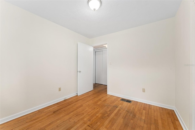 3857 SW 4th Pl, Gainesville, FL 32607 - unfurnished room with baseboards and light wood-type flooring