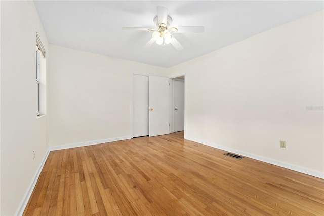3857 SW 4th Pl, Gainesville, FL 32607 - empty room with light wood-style flooring and a ceiling fan