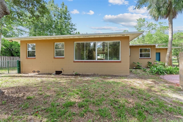 3857 SW 4th Pl, Gainesville, FL 32607 - rear view of property with concrete block siding