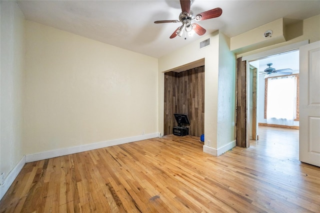 407 NW 8th St, Gainesville, FL 32601 - unfurnished bedroom featuring light wood finished floors and a ceiling fan