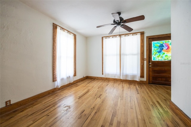 407 NW 8th St, Gainesville, FL 32601 - unfurnished room featuring light wood finished floors and a ceiling fan
