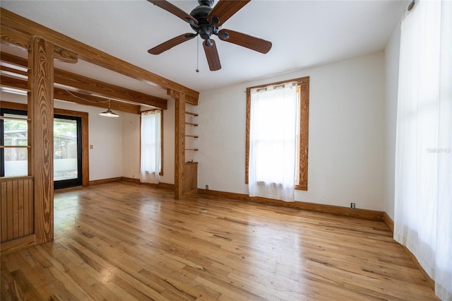 407 NW 8th St, Gainesville, FL 32601 - unfurnished room featuring light wood-style floors, ceiling fan, and beam ceiling