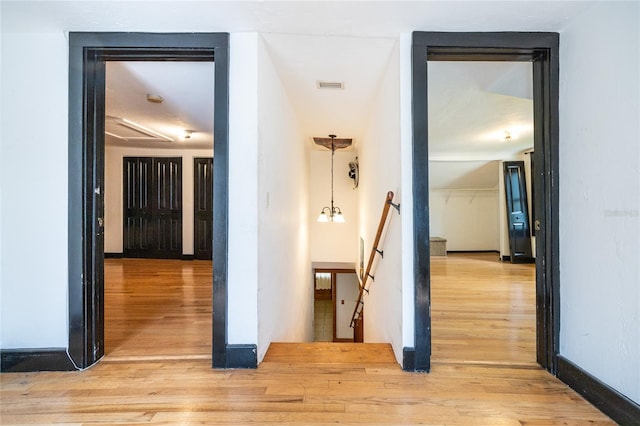 407 NW 8th St, Gainesville, FL 32601 - corridor featuring an upstairs landing and light wood finished floors