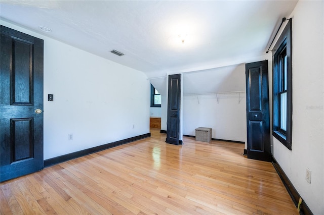 407 NW 8th St, Gainesville, FL 32601 - spare room featuring light wood-style floors and baseboards