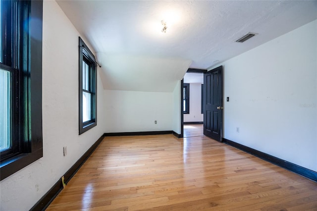 407 NW 8th St, Gainesville, FL 32601 - spare room with light wood-type flooring and baseboards