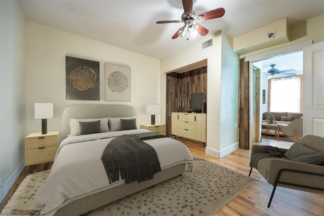 407 NW 8th St, Gainesville, FL 32601 - bedroom with light wood-style floors and ceiling fan