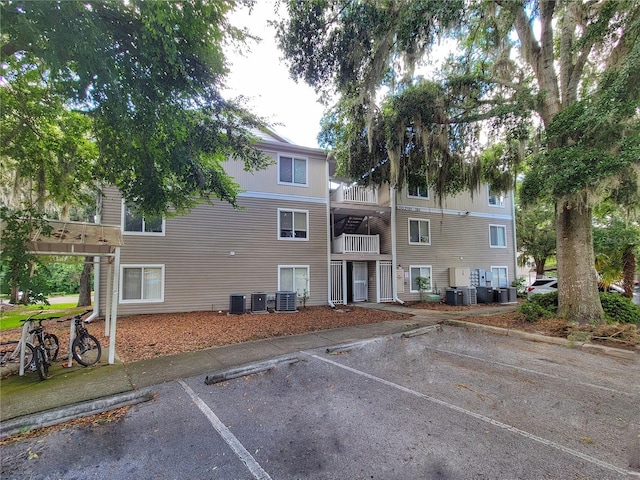 4000 SW 23rd St Unit 2-104, Gainesville, FL 32608 - view of property featuring uncovered parking