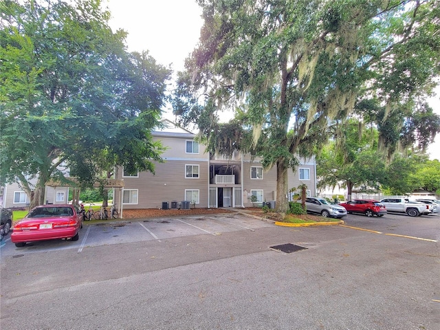 4000 SW 23rd St Unit 2-104, Gainesville, FL 32608 - view of property featuring uncovered parking