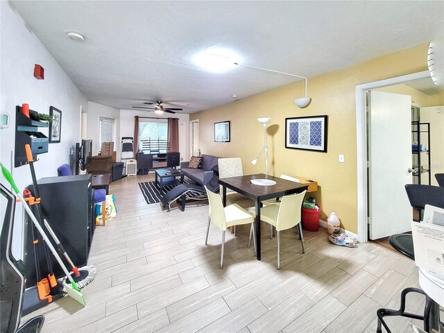 4000 SW 23rd St Unit 2-104, Gainesville, FL 32608 - dining space featuring wood finished floors and ceiling fan