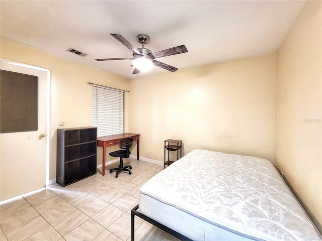 4000 SW 23rd St Unit 2-104, Gainesville, FL 32608 - bedroom featuring ceiling fan and light tile patterned flooring