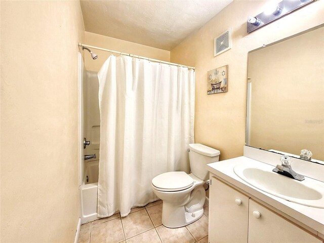 4000 SW 23rd St Unit 2-104, Gainesville, FL 32608 - bathroom with tile patterned flooring, vanity, and shower / bathtub combination with curtain