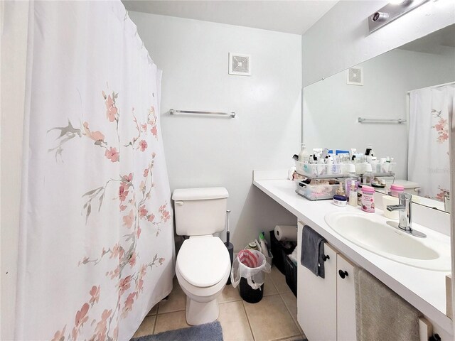 4000 SW 23rd St Unit 2-104, Gainesville, FL 32608 - bathroom with tile patterned floors, vanity, and a shower with curtain