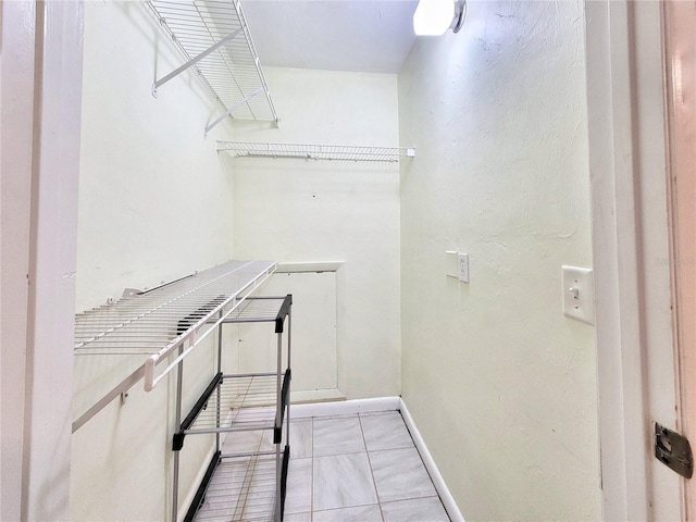 4000 SW 23rd St Unit 2-104, Gainesville, FL 32608 - walk in closet featuring light tile patterned floors