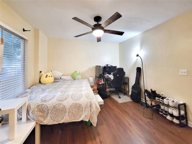4000 SW 23rd St Unit 2-104, Gainesville, FL 32608 - bedroom with wood finished floors, an office area, and ceiling fan