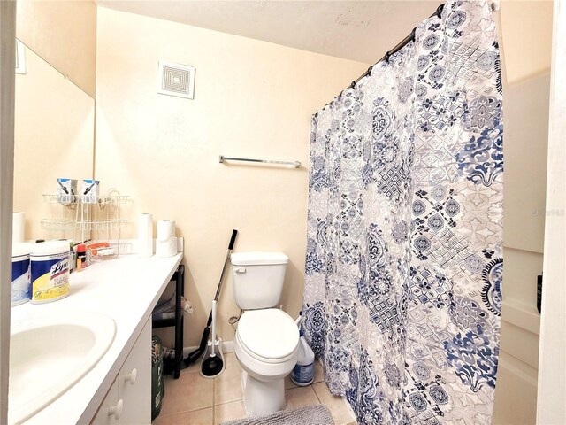 4000 SW 23rd St Unit 2-104, Gainesville, FL 32608 - bathroom featuring vanity, tile patterned floors, and a shower with shower curtain