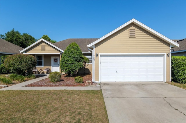 7547 SW 87th Ter, Gainesville, FL 32608 - single story home featuring concrete driveway, a front yard, and a garage