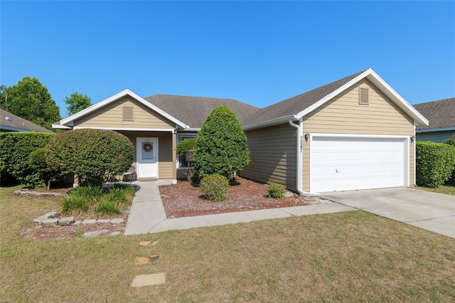 7547 SW 87th Ter, Gainesville, FL 32608 - view of front of house with a front lawn, driveway, a garage, and roof with shingles