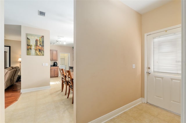 7547 SW 87th Ter, Gainesville, FL 32608 - foyer entrance featuring baseboards and light flooring