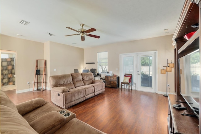 7547 SW 87th Ter, Gainesville, FL 32608 - living room with dark wood-style flooring, a ceiling fan, and a desk