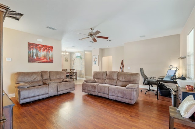 7547 SW 87th Ter, Gainesville, FL 32608 - living area with a ceiling fan, wood finished floors, a chandelier, and a desk