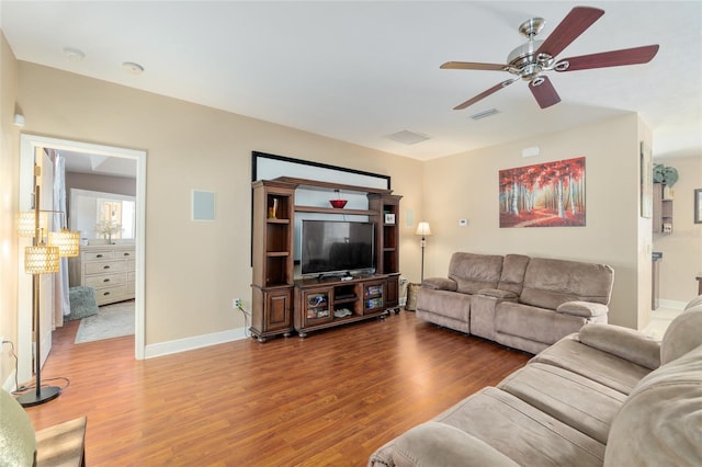 7547 SW 87th Ter, Gainesville, FL 32608 - living area with wood finished floors and ceiling fan