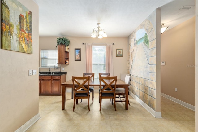 7547 SW 87th Ter, Gainesville, FL 32608 - dining area with a chandelier and baseboards