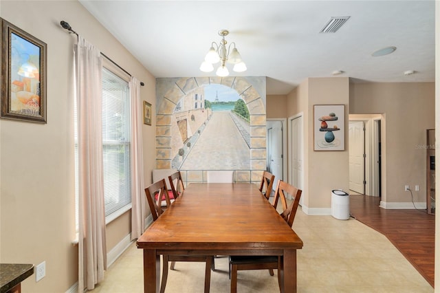7547 SW 87th Ter, Gainesville, FL 32608 - dining space with a chandelier and baseboards