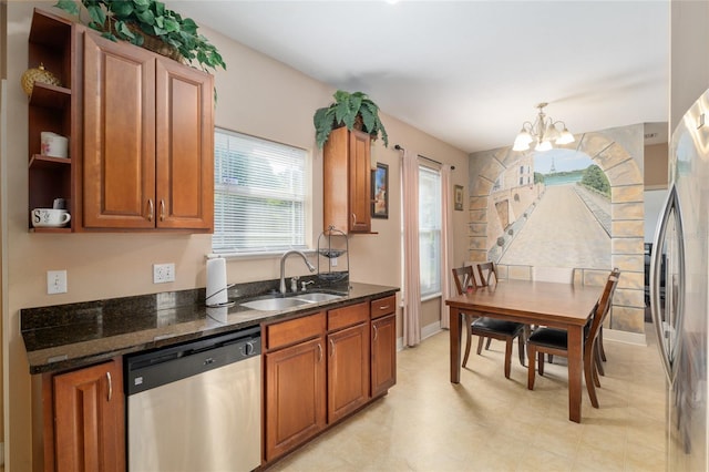 7547 SW 87th Ter, Gainesville, FL 32608 - kitchen with appliances with stainless steel finishes, a chandelier, open shelves, and brown cabinets