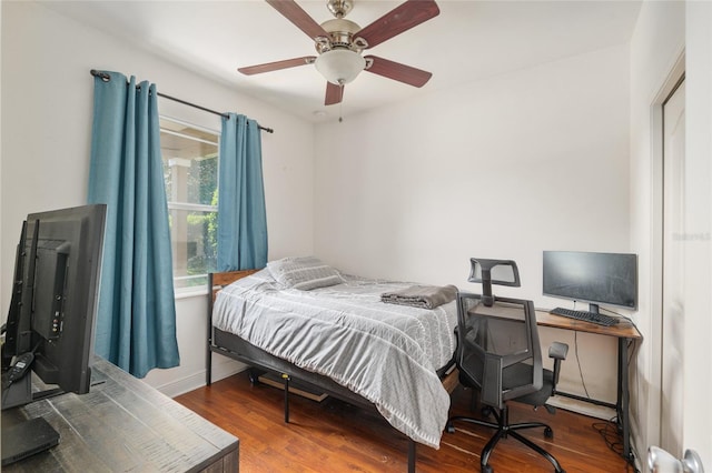7547 SW 87th Ter, Gainesville, FL 32608 - bedroom with wood finished floors, ceiling fan, and an office area