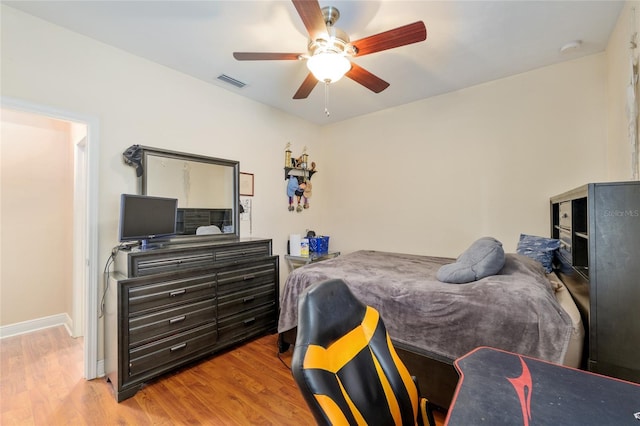 7547 SW 87th Ter, Gainesville, FL 32608 - bedroom with wood finished floors and ceiling fan