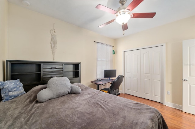 7547 SW 87th Ter, Gainesville, FL 32608 - bedroom with wood finished floors, a closet, and ceiling fan