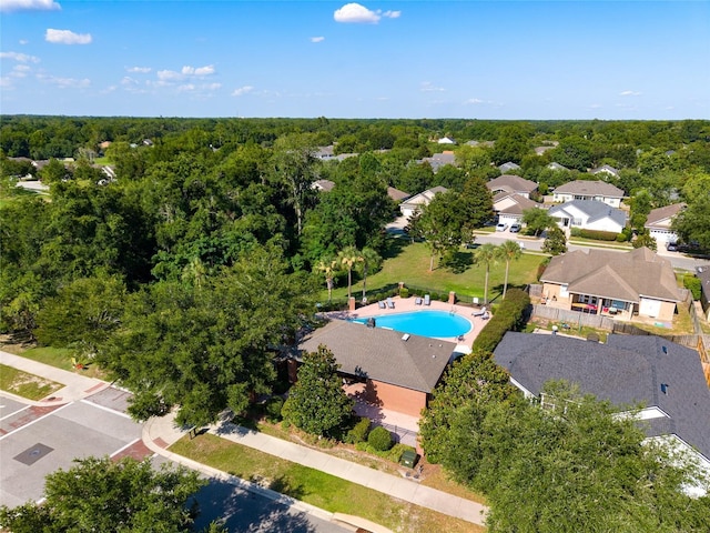 7547 SW 87th Ter, Gainesville, FL 32608 - aerial perspective of suburban area with a pool and a forest