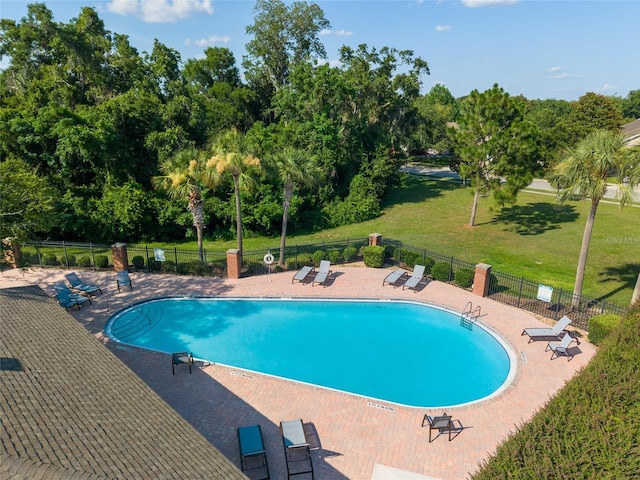 7547 SW 87th Ter, Gainesville, FL 32608 - community pool with a patio and view of scattered trees