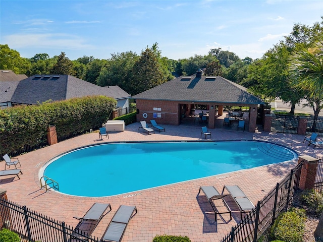 7547 SW 87th Ter, Gainesville, FL 32608 - community pool with a patio area