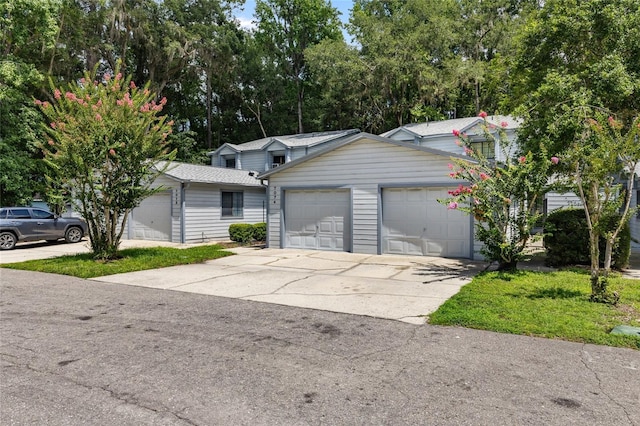 7074 NW 52nd Ter, Gainesville, FL 32653 - view of front facade with a garage and driveway