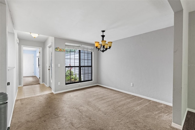 7074 NW 52nd Ter, Gainesville, FL 32653 - carpeted empty room with a chandelier and tile patterned flooring