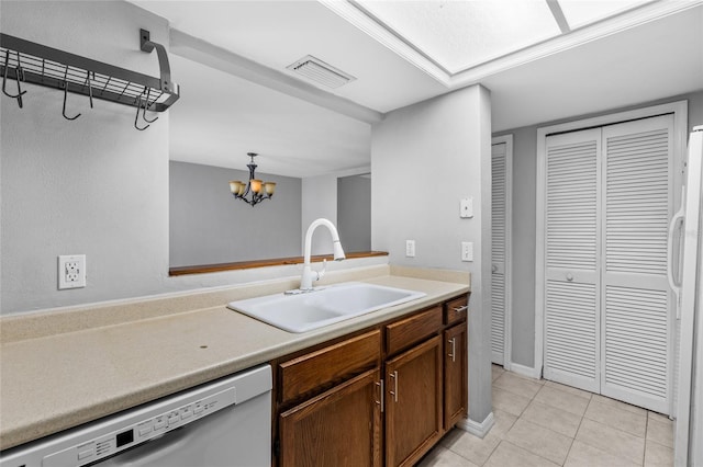 7074 NW 52nd Ter, Gainesville, FL 32653 - kitchen featuring white appliances, a chandelier, light tile patterned flooring, light countertops, and hanging light fixtures