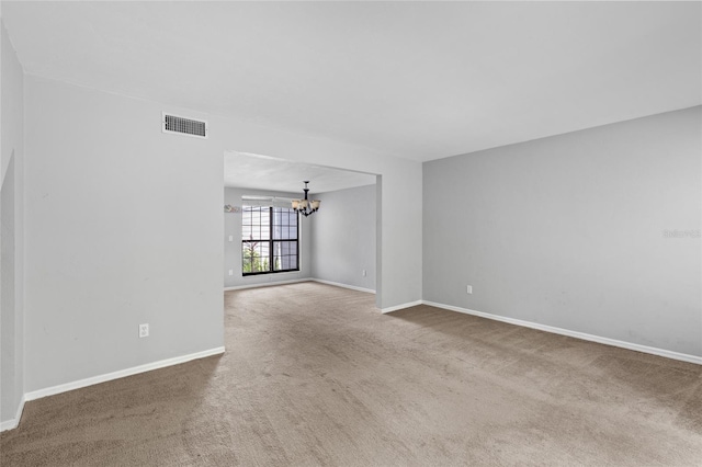 7074 NW 52nd Ter, Gainesville, FL 32653 - unfurnished room with a chandelier and carpet floors