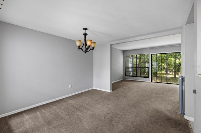 7074 NW 52nd Ter, Gainesville, FL 32653 - carpeted empty room featuring a chandelier and baseboards