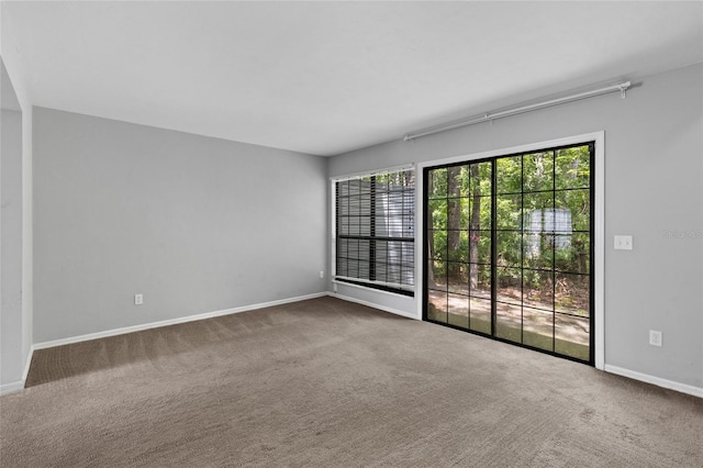 7074 NW 52nd Ter, Gainesville, FL 32653 - empty room with carpet and baseboards