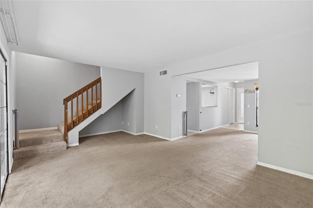 7074 NW 52nd Ter, Gainesville, FL 32653 - unfurnished living room featuring carpet floors and stairs