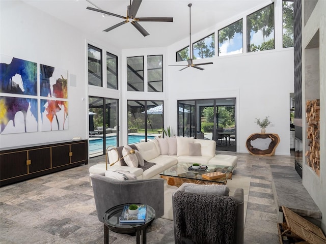 2261 NW 24th Ave, Gainesville, FL 32605 - living area featuring a ceiling fan and a high ceiling