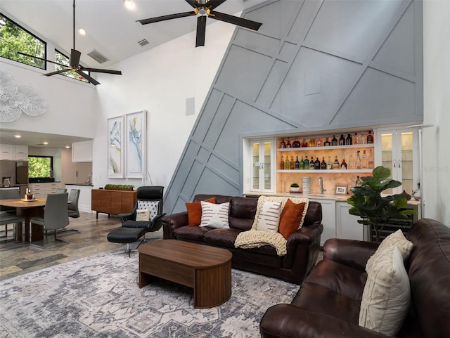 2261 NW 24th Ave, Gainesville, FL 32605 - living room featuring ceiling fan, high vaulted ceiling, a dry bar, and recessed lighting