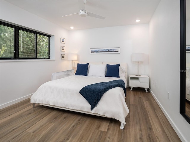 2261 NW 24th Ave, Gainesville, FL 32605 - bedroom featuring wood finished floors, a ceiling fan, and recessed lighting