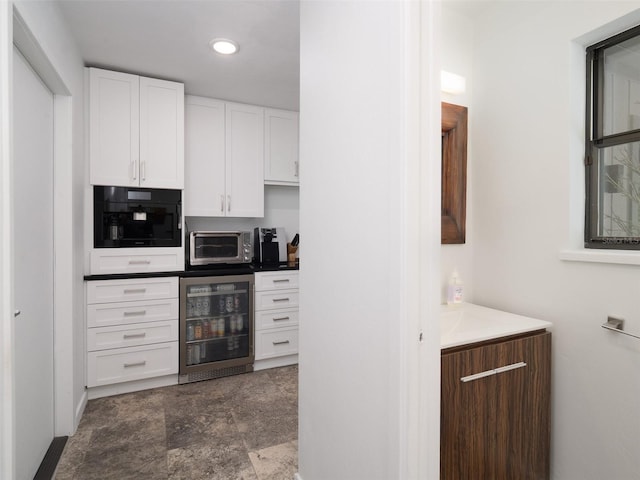 2261 NW 24th Ave, Gainesville, FL 32605 - bar with wine cooler, recessed lighting, and dark stone finish floors