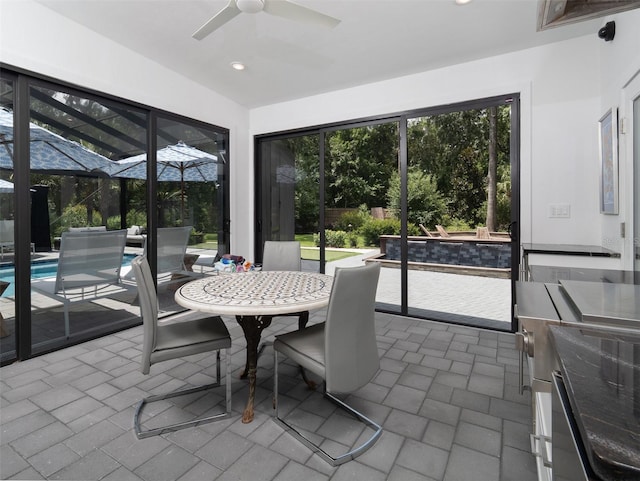 2261 NW 24th Ave, Gainesville, FL 32605 - sunroom / solarium featuring a ceiling fan and outdoor dining area